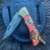 Damascus Steel Folding Knife with Carved Brass